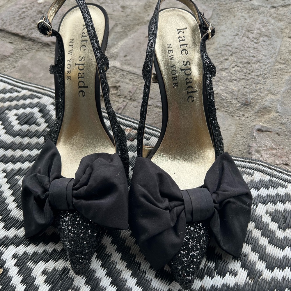 Kate spade heels with a bow and glitter.